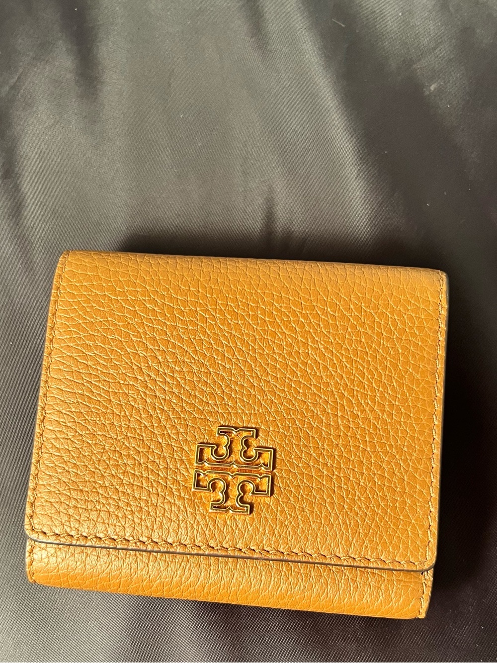 Tory Burch Britten Brown Moose Pebbled Leather Tri-Fold Wallet 4” L x 3.75” W